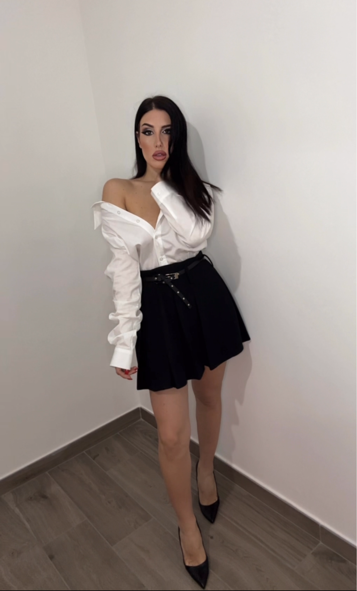 Minigonna a pieghe con cintura