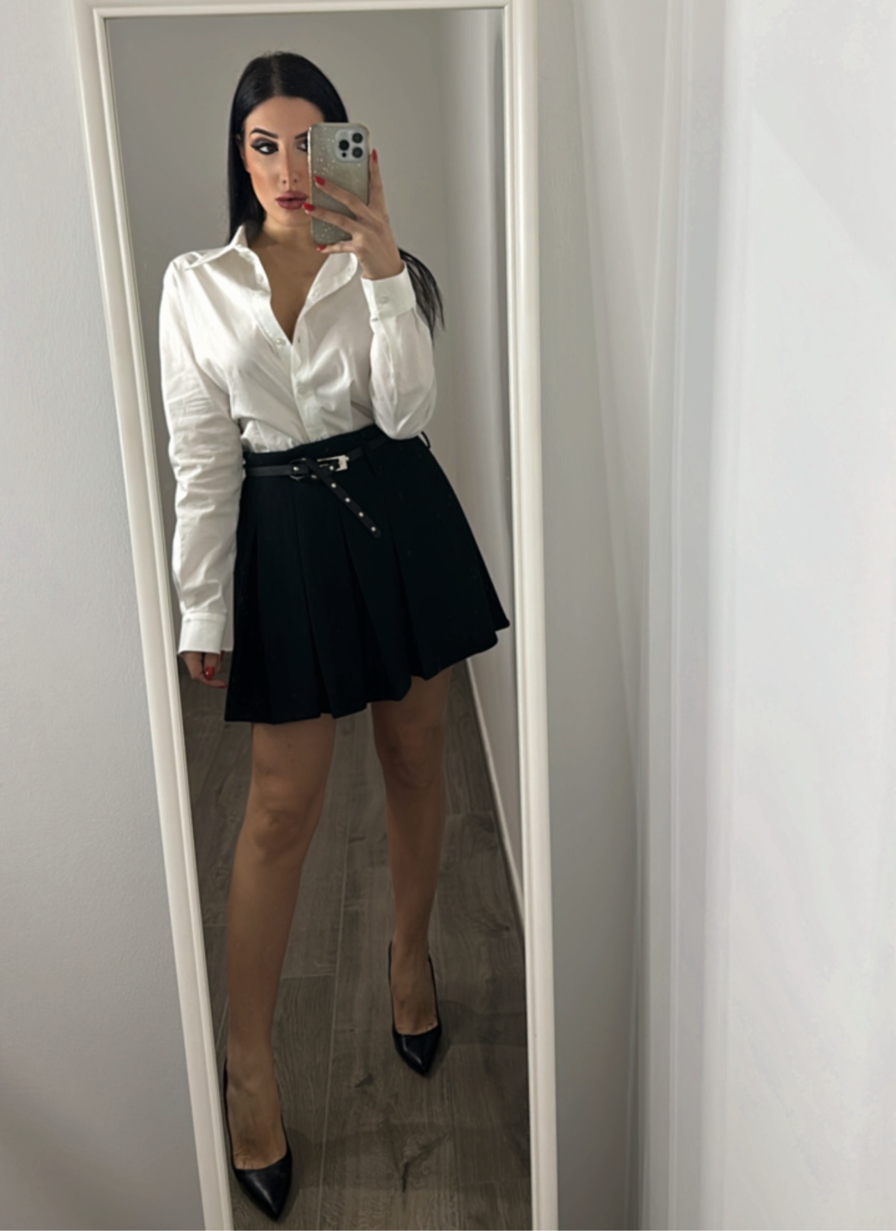 Minigonna a pieghe con cintura