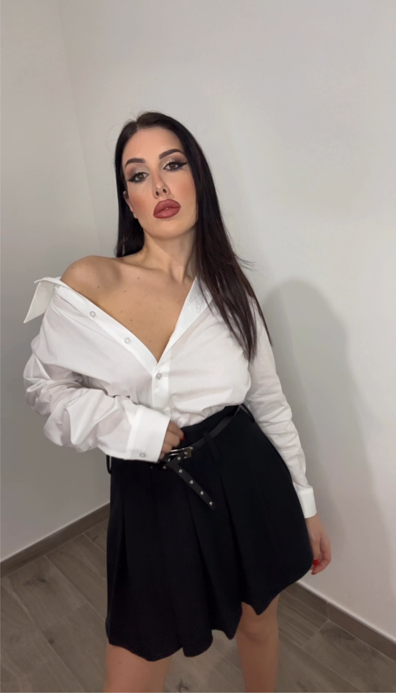 Minigonna a pieghe con cintura