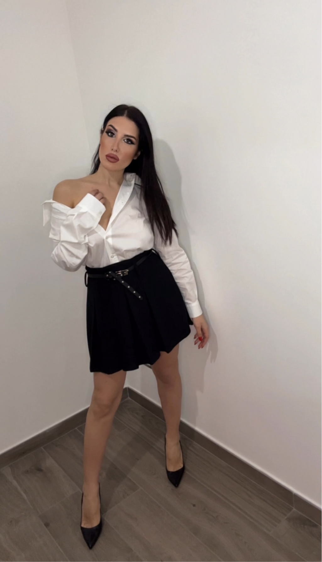 Minigonna a pieghe con cintura