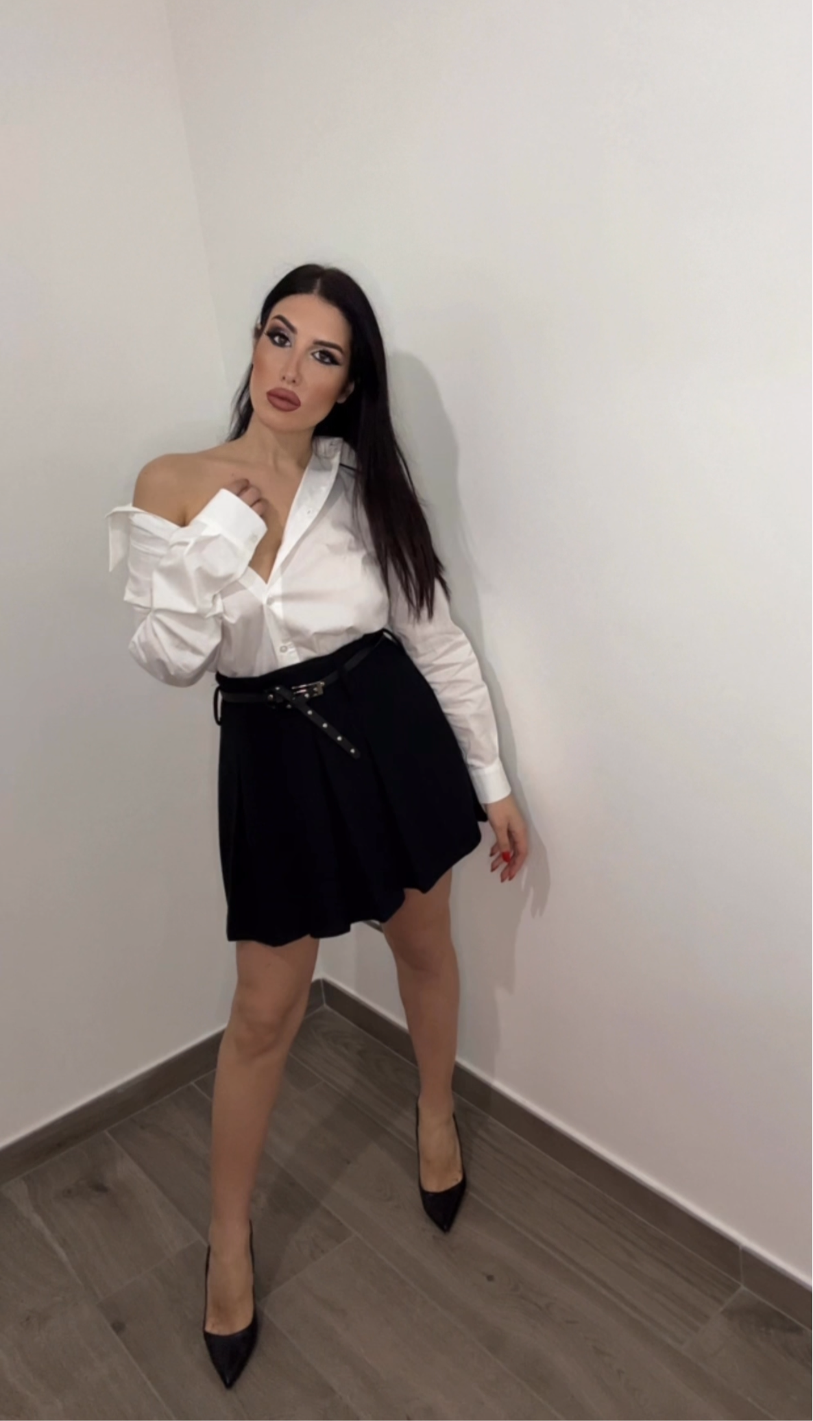 Minigonna a pieghe con cintura