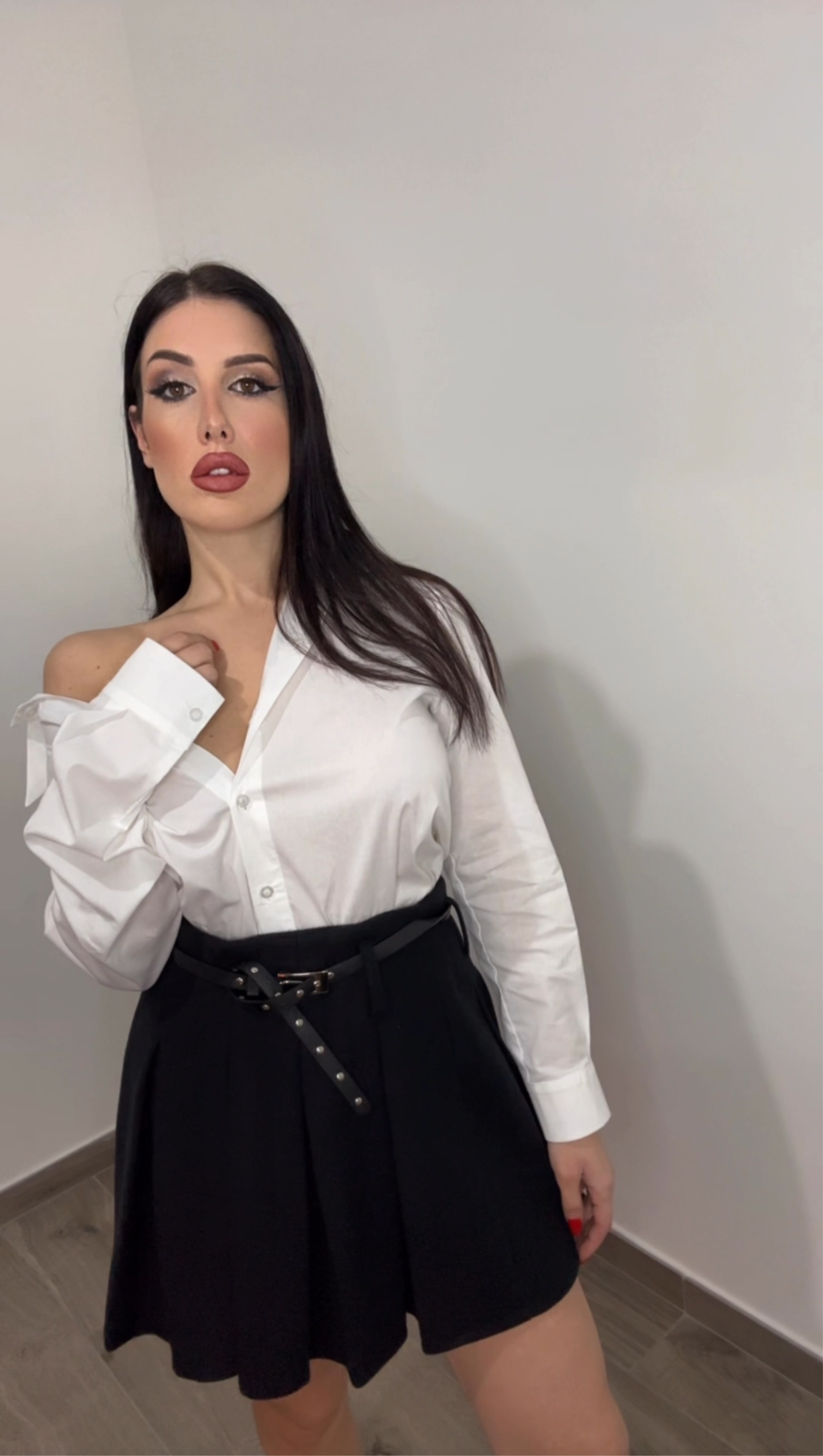 Minigonna a pieghe con cintura